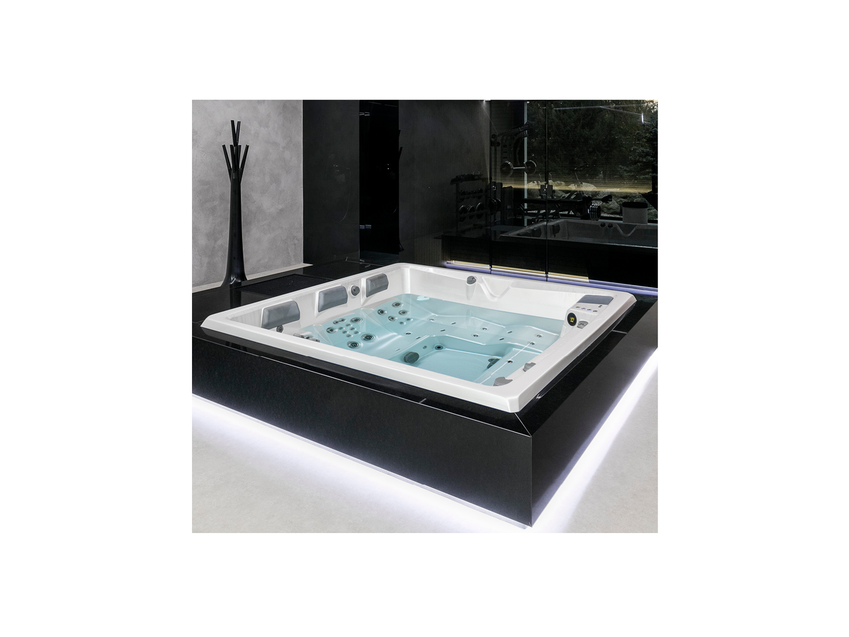 Modernes Whirlpool-Modell von USSPA mit elegantem Design, integrierten Düsen und hellen Wasser, platziert auf einem schwarzen Podest in einem stilvollen Raum – perfekt für private Entspannung und Hydrotherapie.